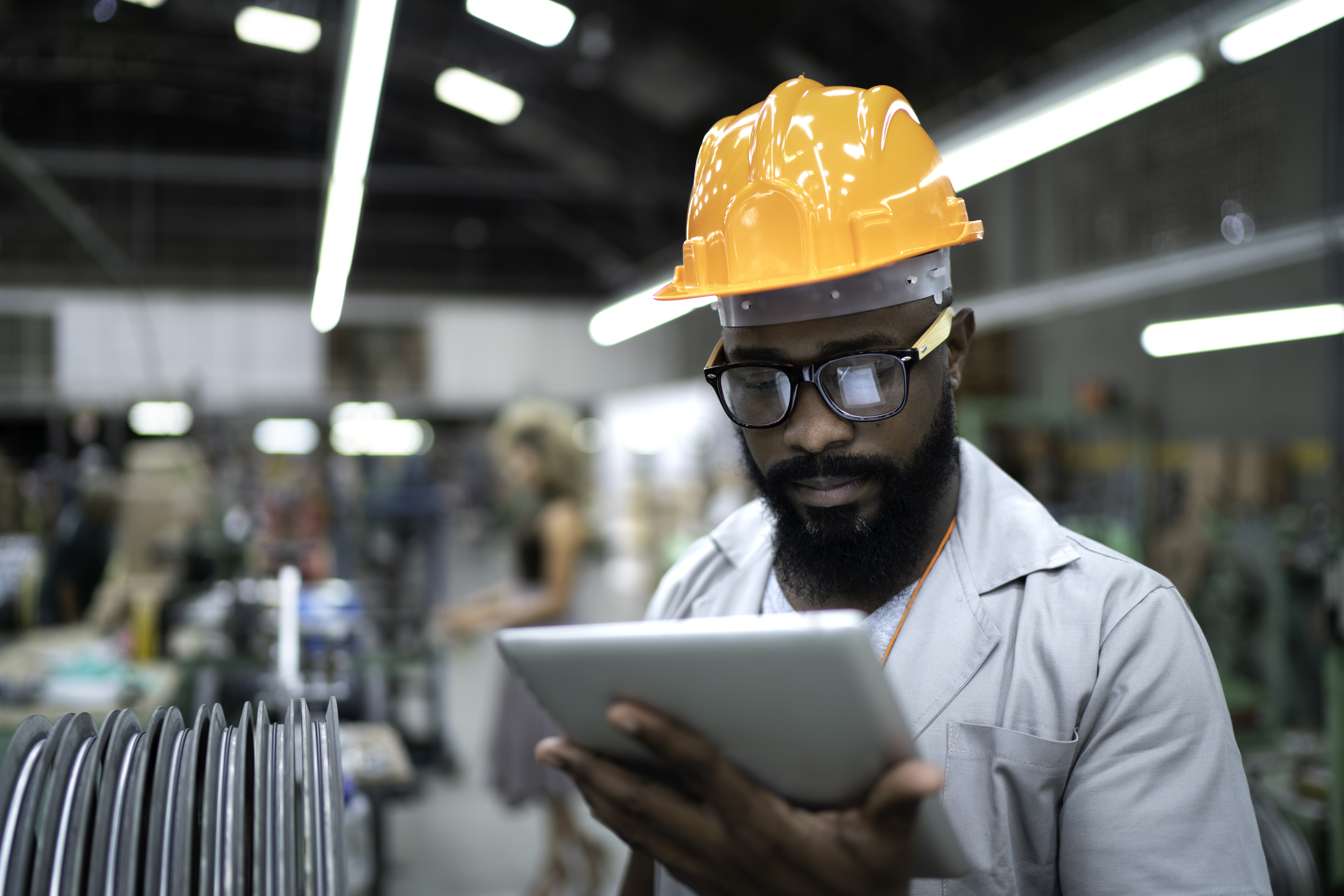 Manufacturing worker looking at tablet